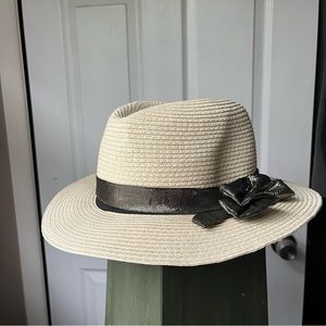 Stylish straw Panama hat with metallic silver bow